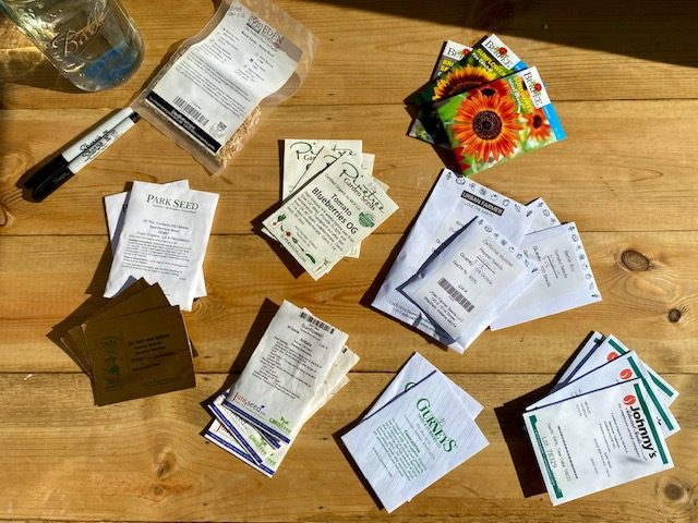 seed packets, tools and supplies for seed starting