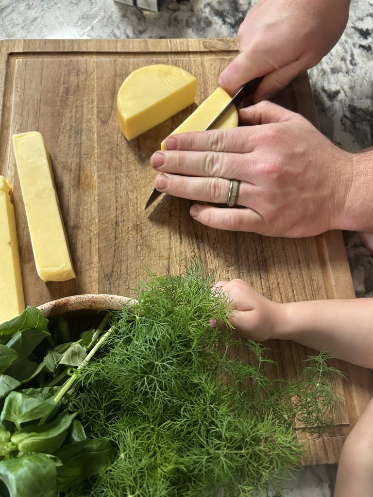 slicing cheese to put in the homemade cheese ball