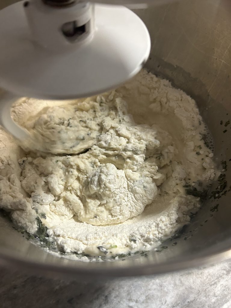 mixing homemade rosemary crackers
